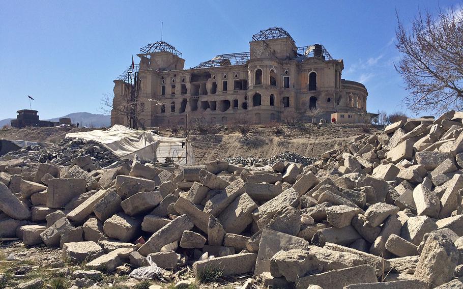 Heaps of stone have been trucked to Kabul's Darul Aman Palace, where they will be used to build a wall around the sprawling complex, seen here on Sunday,  Feb. 28, 2016. Work to restore the palace, destroyed in Afghanistan's civil war in the 1990s, will take at least three years.