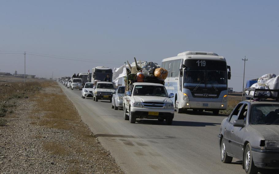 The road out of Mosul was clogged on Thursday, Nov. 3, 2016, with civilians fleeing fighting as Iraqi forces pushed into the outskirts of the city as they advanced their offensive to oust the Islamic State group from its last major stronghold in Iraq.