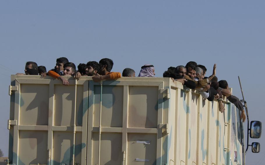 Iraqis crowded into a truck headed away from the city of Mosul on Thursday, Nov. 3, 2016. As Iraqi forces began to push into the outskirts of the city in their offensive to push out Islamic State militants, the road out of the city was clogged with vehicles carrying fleeing civilians.