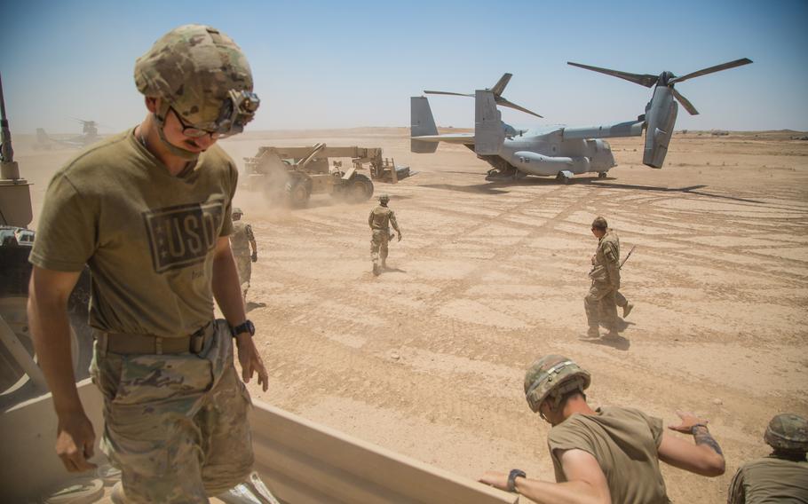 A U.S. Marine Corps MV-22 lands at a remote location near the Iraqi-Syrian border to resupply Marines and soldiers with the 3rd Cavalry Regiment, June 23, 2018. Iraqi Security Forces and coalition partners provided fire support to assist the Syrian Democratic Forces as they continue Operation Roundup, the military offensive to accelerate the defeat of ISIS remnants in the Middle Euphrates River Valley and Iraq-Syria border region.