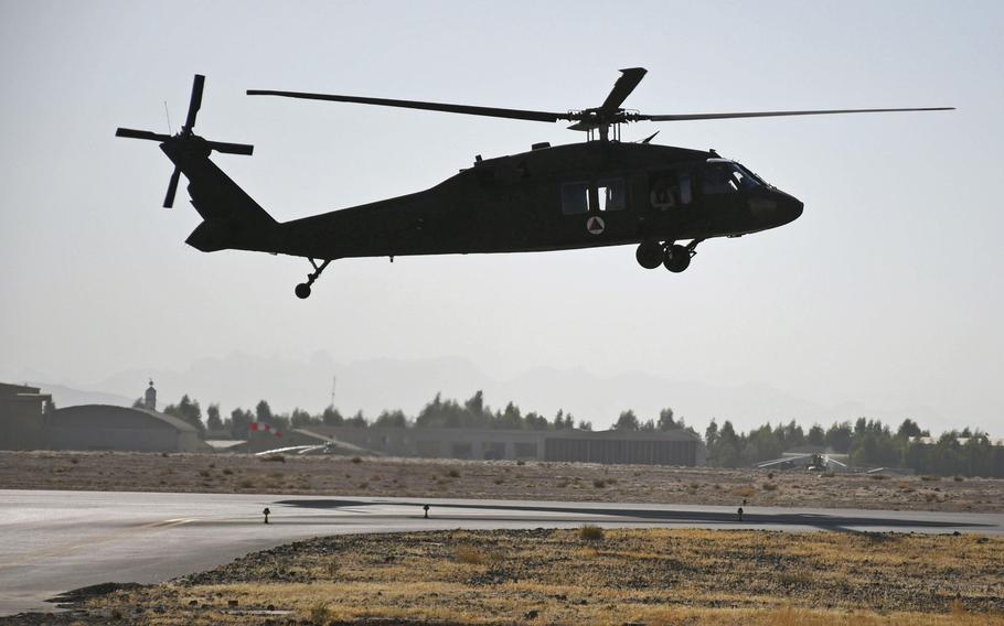 An Afghan pilot practices flying one of Afghanistan's new UH-60 Black Hawk helicopters at Kandahar Air Field on Sunday, Nov. 5, 2017.