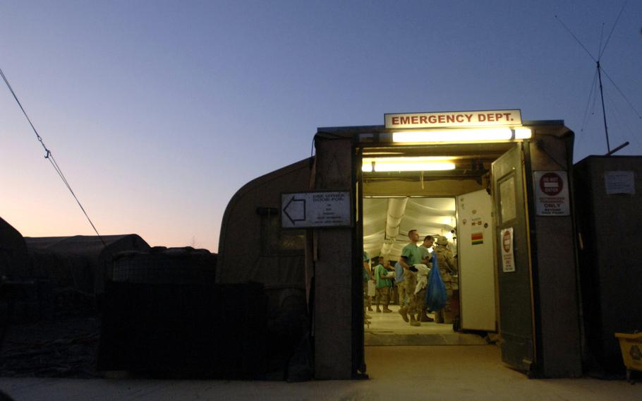 Medics work on the last patient of the day in the emergency room of the Air Force Theater Hospital on Balad Air Base, Iraq, Feb. 2007. A recent report said that survival rates increased three-fold during the wars in Iraq and Afghanistan.