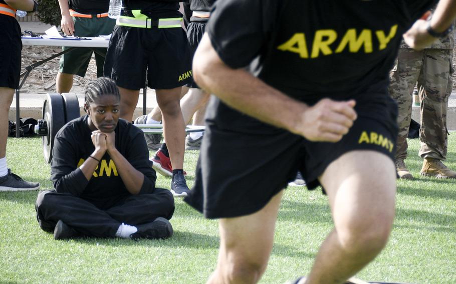 Spc. Tangela Starr watches as a soldier sprints during the new Army fitness test, conducted as a test run during deployment to Camp Arifjan, Kuwait, March 23, 2019. The new test includes exercises such as the deadlift, which proved difficult for some.