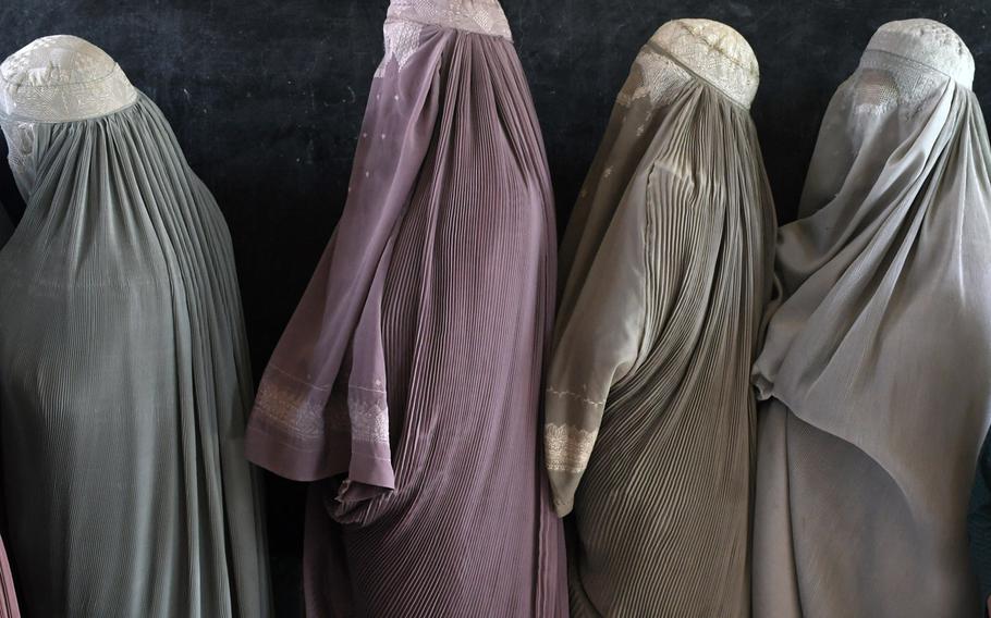 Women wait in line to vote at a polling center in Kandahar, Afghanistan in 2018. The Taliban have refuted a report that women will be included in their delegation attending peace negotiations in Qatar later this week.