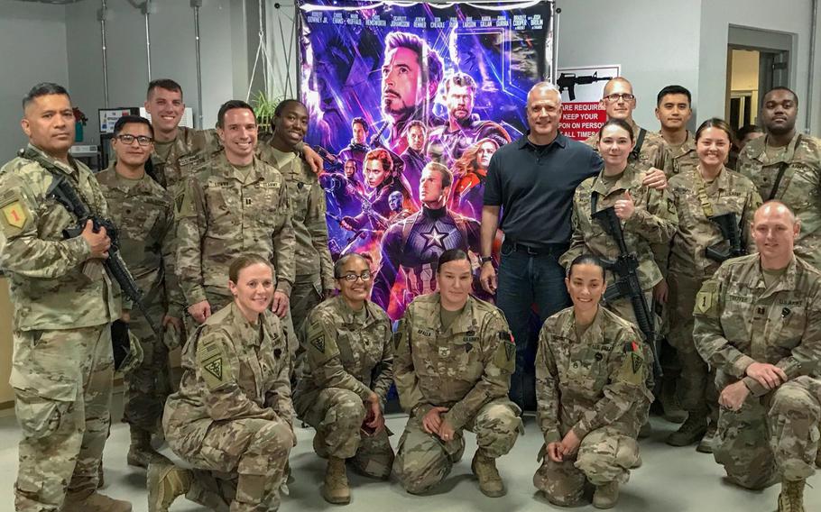 Troops deployed to Bagram Air Field prepare to watch the movie "Avengers: Endgame," which was brought to Afghanistan by Ken Caldwell, center, senior vice president of North American theatrical distribution for the Army and Air Force Exchange Service.