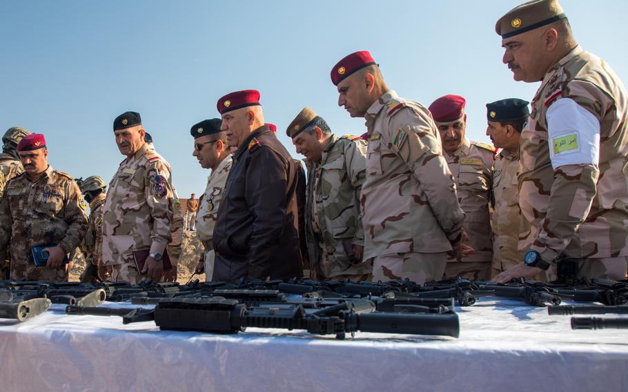 Lt. Gen. Jalil Jabbar al-Rubaine, commander of the Baghdad Operations Command, Iraqi, inspects weapons at an event at Camp Taji, Iraq, Jan. 23, 2019. Four Iraqi battalions took part in the final test at the end of the 10-week training at the School of Infantry NCO II.