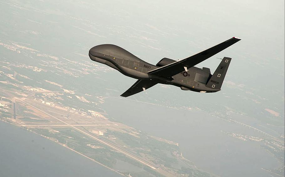In this undated file photo an RQ-4 Global Hawk conducts tests over Naval Air Station Patuxent River, Md. Iran's Revolutionary Guard shot down a Global Hawk drone Thursday, June 20, 2019. The U.S. said the attack occurred over international airspace, while Iran said it happened over their territory.