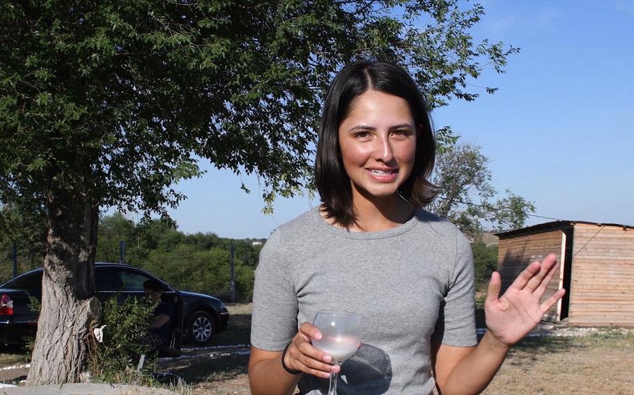 Army Spc. Shyla Alam, 22, tries fermented horse milk in Kazakhstan, where she was taking part in the U.S.-led Steppe Eagle exercise in June 2019. "Very sour," said Alam, a member of the Minnesota National Guard's 34th Infantry Division Headquarters Battalion.