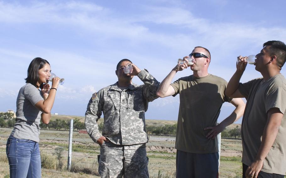 U.S. soldiers, from left to right, Spc. Shyla Alam, Staff Sgt. Anthony McGee, Sgt. 1st Class Lucas Hansen and Spc. Uriel Ochoa, try the Kazakh specialty kumis, or fermented horse milk. The soldiers, who were in Kazakhstan in June 2019 for the annual Steppe Eagle exercise, had different reactions after tasting the beverage.