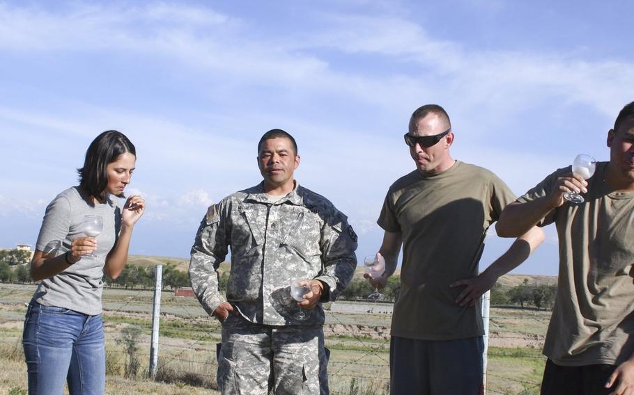U.S. soldiers, from left to right, Spc. Shyla Alam, Staff Sgt. Anthony McGee, Sgt. 1st Class Lucas Hansen and Spc. Uriel Ochoa, react after tasting the Kazakh specialty kumis, or fermented horse milk. The soldiers were in Kazakhstan in June 2019 for the annual Steppe Eagle exercise.