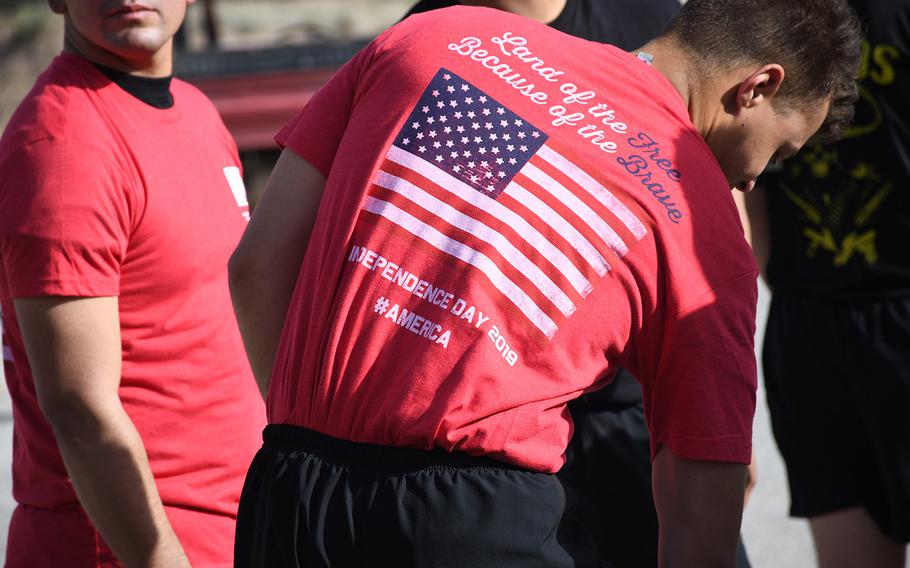 A U.S. soldier at Forward Operating Base Dahlke wears a T-shirt that was distributed to those who participated in a 5-kilometer race to mark Independence Day on Thursday, July 4, 2019.