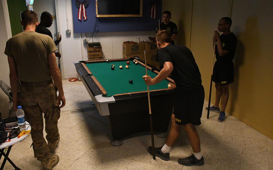U.S. soldiers play pool inside a USO facility at Forward Operating Base Dahlke on Thursday, July 4, 2019. The facility officially opened on Independence Day.