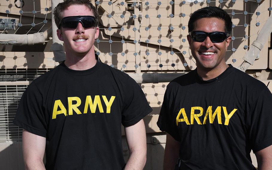 Spc. Joe Murray, left, and Capt. Anant pose for a photo during Independence Day celebrations at Forward Operating Base Dahlke on Thursday, July 4, 2019.