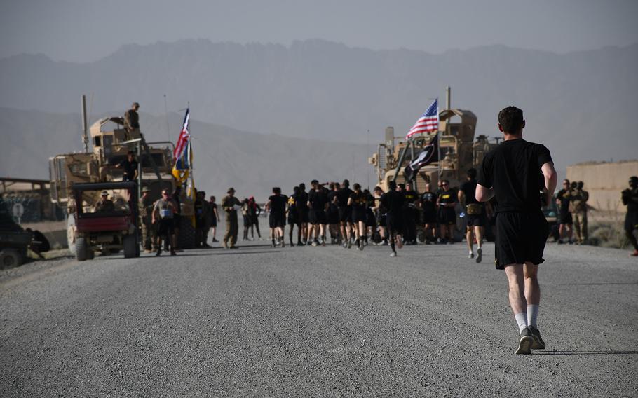 A U.S. soldier approaches the finish line of a 5-kilometer race at Forward Operating Base Dahlke on Thursday, July 4, 2019. The race was one a several activities at the base to mark Independence Day.