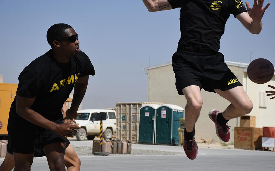 U.S. troops take part in a basketball competition as part of activities to mark Independence Day at Forward Operating Base Dahlke, in Afghanistan's Logar province on Thursday, July 4, 2019.