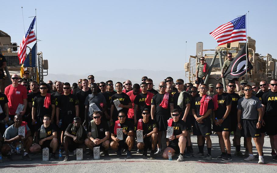 U.S. soldiers at Forward Operating Base Dahlke, in Afghanistan's Logar province, pose for a photo after running a 5-kilometer race to mark Independence Day on Thursday, July 4, 2019. 