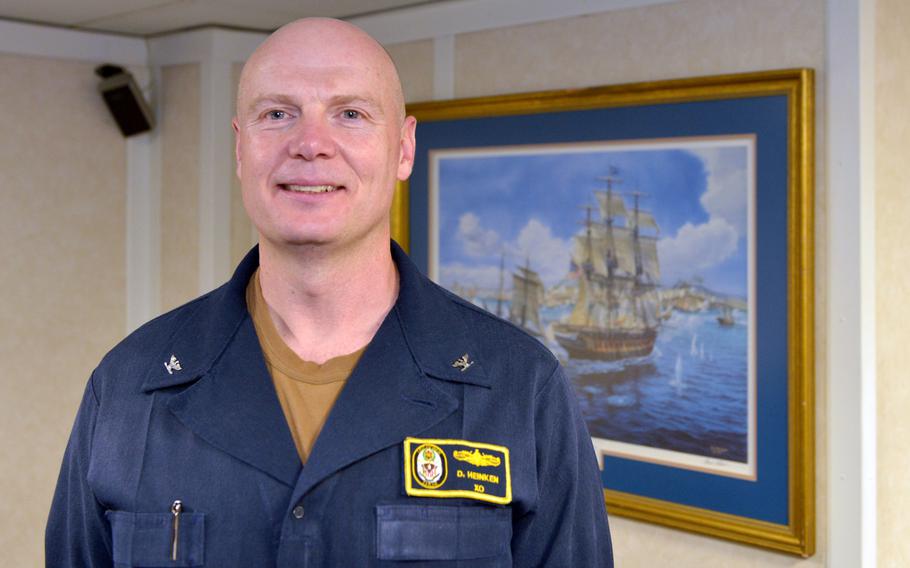 Capt. Dale Heinken, executive officer on board the amphibious assault ship USS boxer, poses for a photo on Aug. 1, 2019.