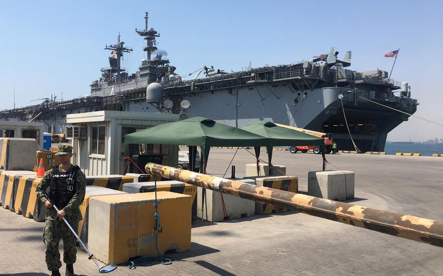 The amphibious assault ship USS Boxer is seen in Bahrain's Khalifa bin Salman Port on Aug. 1, 2019. Boxer pulled into Bahrain on July 25 for a scheduled weeklong port visit just days after crew members downed at least one drone during inbound transit through the Strait of Hormuz on July 18.