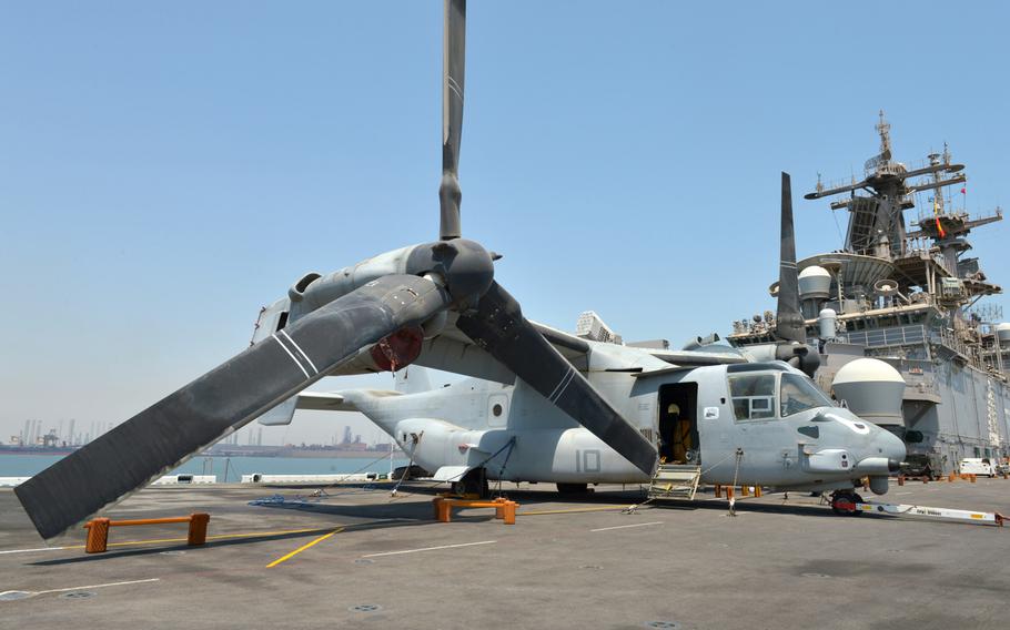 An MV-22 Osprey tilt-rotor aircraft rests on the flight deck of the amphibious assault ship USS Boxer on Aug. 1, 2019.  