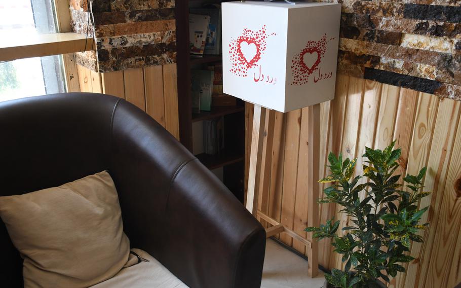 A letter box for the Dard-e-Dil campaign, which aims to share Afghans' worries and recommendations with negotiators at peace talks, stands in a Kabul cafe on Thursday, Aug. 1, 2019.