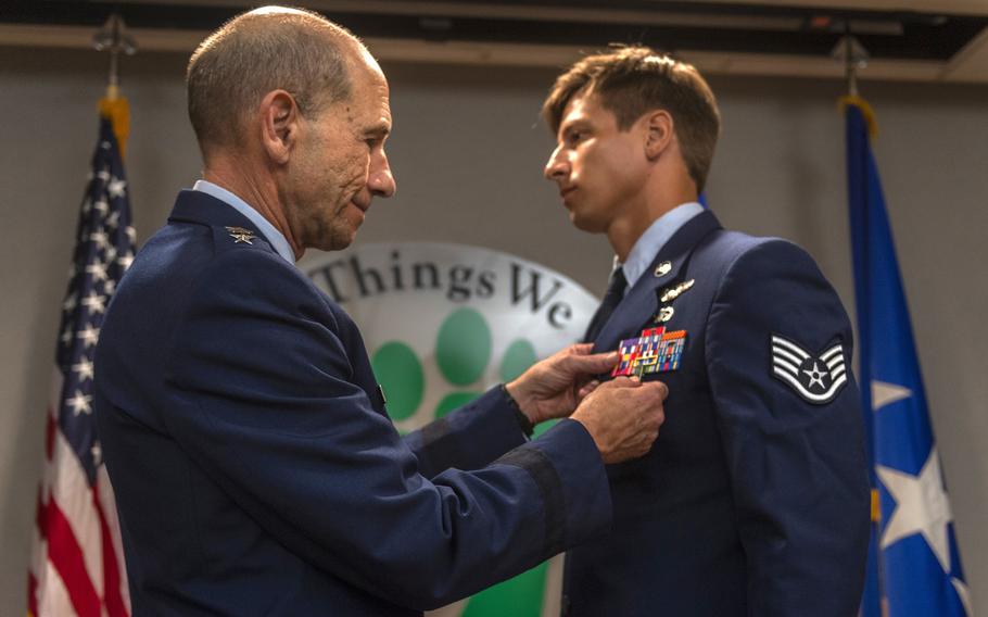 Gen. Mike Holmes, left, commander of Air Combat Command, pins a Bronze Star Medal with valor to Staff Sgt. Aaron Metzger, right, 38th Rescue Squadron pararescueman, Aug. 26, 2019, at Moody Air Force Base, Ga. Metzger was awarded the medal after fighting the Taliban and aiding others while deployed to Afghanistan in 2018.