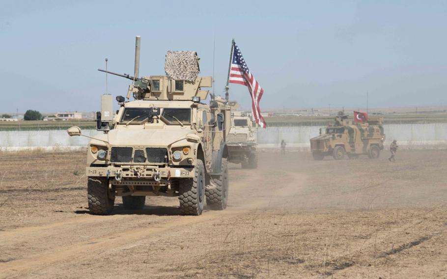 U.S. and Turkish military forces conduct a joint ground patrol in northeast Syria on Sunday, Sept. 8, 2019, to observe progress on destroyed Kurdish militia fortifications and areas where Kurdish elements voluntarily departed.