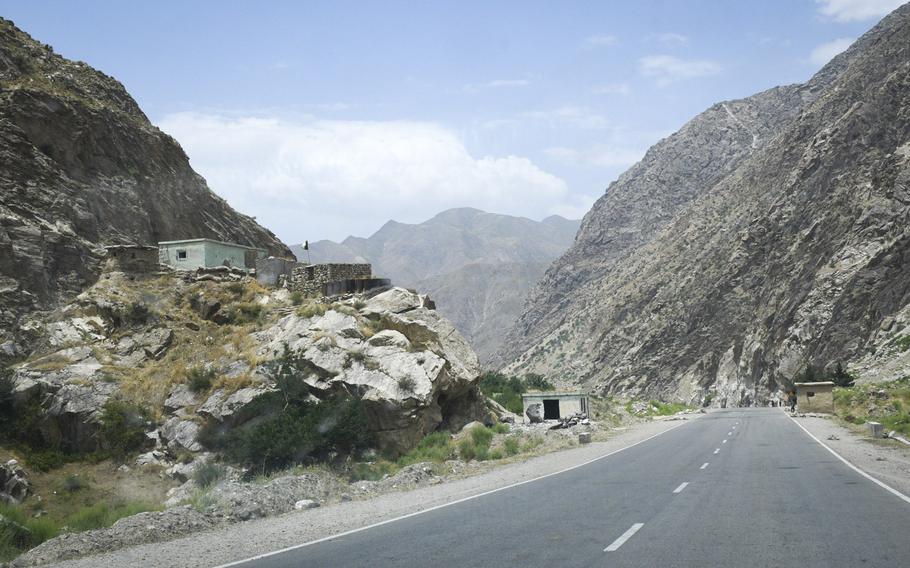 An Afghan police checkpoint near the neck of a narrow and winding valley overlooks a paved road to Faizabad, the provincial capital of remote Badakhshan province, Afghanistan. A year after it signed a contract, American company Centar Ltd. has still not begun gold or copper mining operations in Afghanistan's Balkhab and Badakhshan provinces amid security concerns.