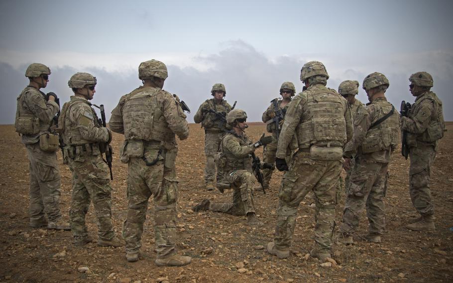 U.S. soldiers gather for a brief during a combined joint patrol rehearsal in Manbij, Syria, Nov. 7, 2018. The U.S. is considering sending troops back into Syria to guard oil fields.