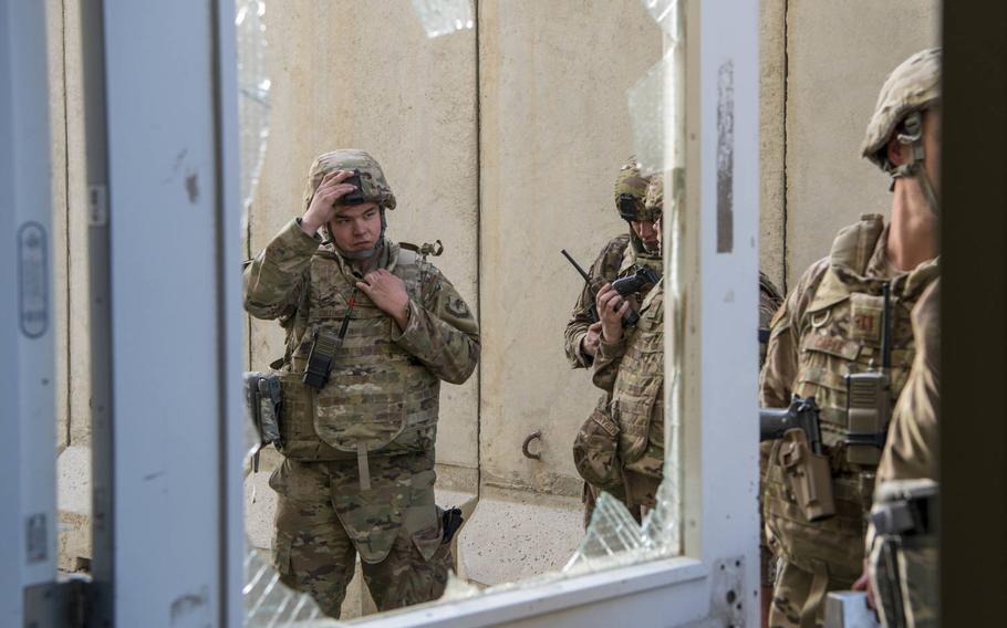 U.S. Air Force Senior Airman Mytchell Collingridge from the 405th Expeditionary Support Squadron Civil Engineer Flight, 455th Air Expeditionary Wing, helped in efforts to clean up debris and repair broken windows after an attack near Bagram Airfield, Afghanistan, Dec. 11, 2019. Civil engineers began fixing the base as gunfire continued in an effort to get Bagram back to normal operating status.