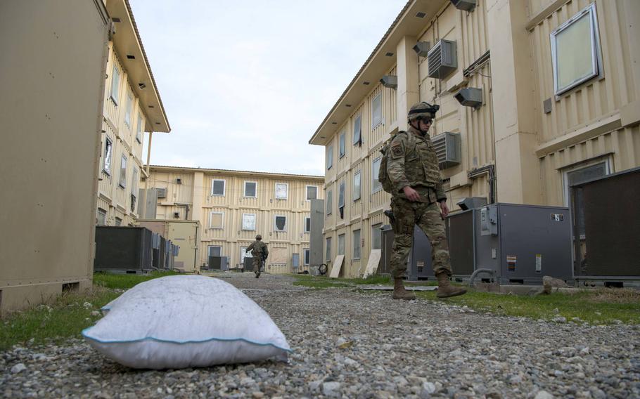 A pillow that was blown outside a service member's room lies on the ground while civil engineers from the 405th Expeditionary Support Squadron, 455th Air Expeditionary Wing, begin recovery operations at Bagram Airfield, Afghanistan, Dec. 11, 2019.