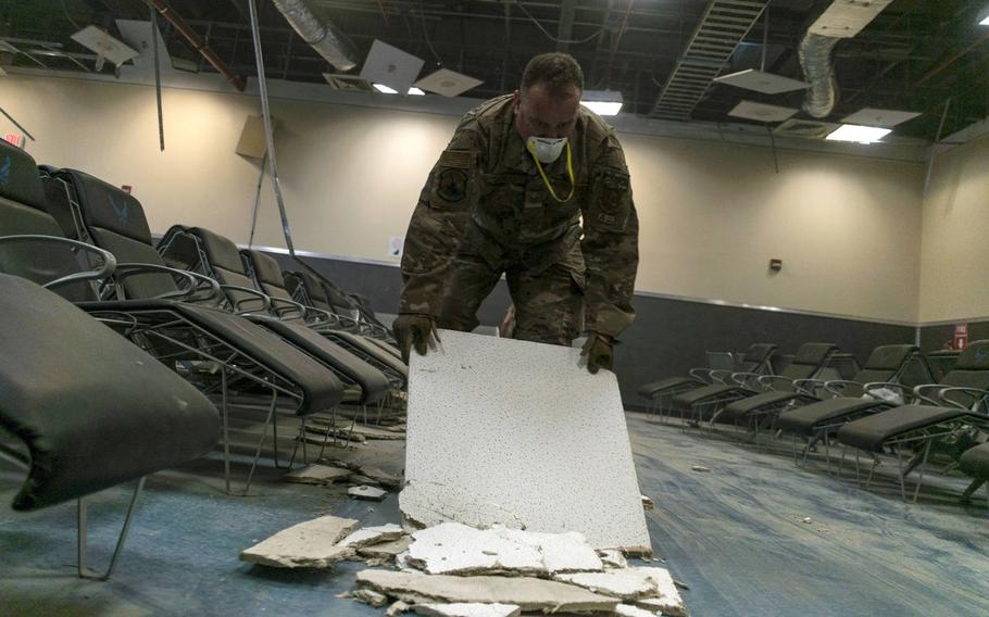 U.S. Air Force Tech. Sgt. Ryan Schell, a U.S. Central Command Materiel Recovery Element technician for the 405th Expeditionary Support Squadron, clears debris inside the passenger terminal the day after a Taliban attack at Bagram Airfield, Afghanistan, Dec. 12, 2019.