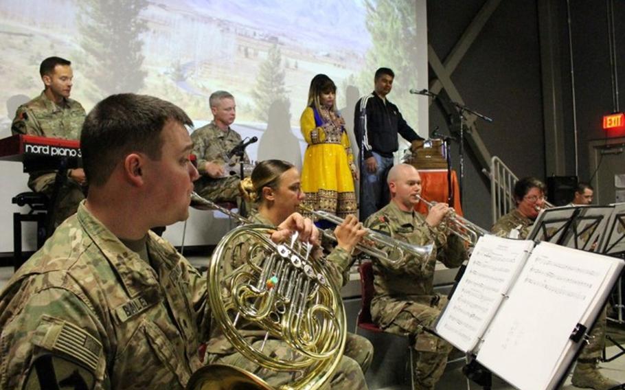 Afghan and American musicians assemble on Oct. 23, 2016, at Bagram Airfield. The two groups of musicians closed the show in a joint performance of two traditional Dari folk songs.