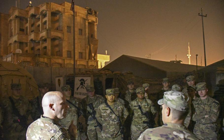 Col. Matthew W. Brown, commander of the 1st Stryker Brigade Combat Team, 25th Infantry Division, speaks to troops of the 1st Battalion, 24th Infantry, following an awards ceremony at a camp in Mosul, Iraq, on Thursday, Dec. 26, 2019.
