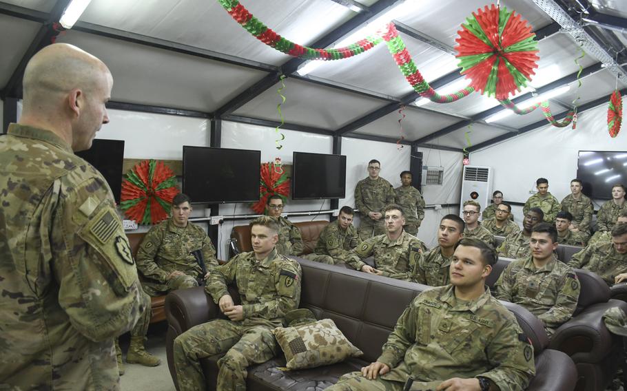 Troops from the 1st Battalion, 24th Infantry gather for a discussion with their brigade commander, Col. Matthew W. Brown, head of 1st Stryker Brigade Combat Team, 25th Infantry Division, at a base camp in the Iraqi city of Mosul on Thursday, Dec. 26, 2019.