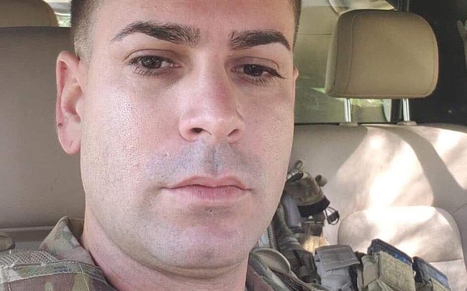 Sgt. 1st Class Elis A. Barreto Ortiz, 34, from Morovis, Puerto Rico, poses for a selfie from the cab of his unarmored pick-up truck while on a convoy through Kabul, Afghanistan. 
Barreto, who was promoted posthumously, died Sept. 5, 2019, when a Taliban suicide bomb tore through his convoy.