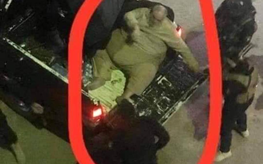 Online pictures of the arrest of Islamic State official Abu Abdul Bari, show that he had to be crammed into the bed of a police pickup truck after his capture in Mosul. Iraqi officials announced Bari's arrest on Thursday, January 16, 2020.