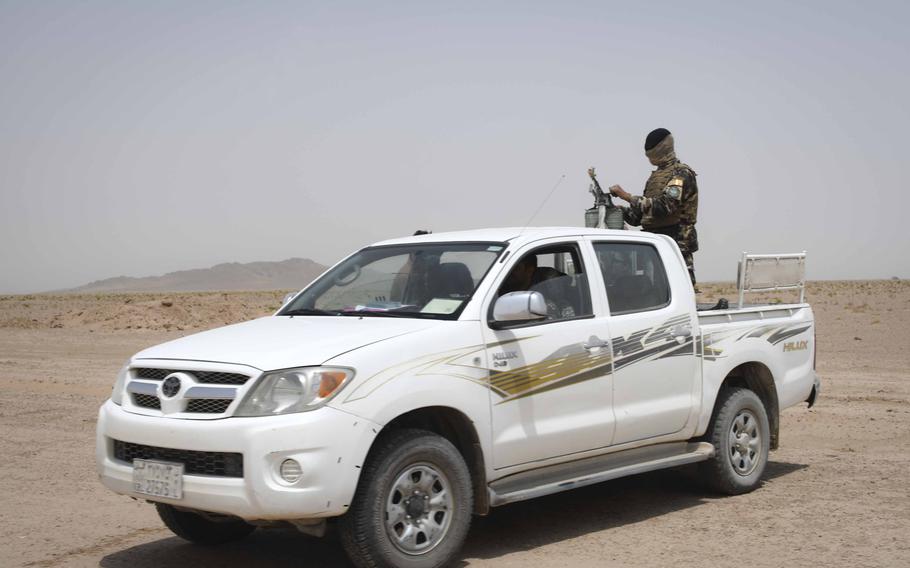 An Afghan policeman stands guard while on a patrol south of Herat in western Afghanistan in 2018. The leader of a Taliban splinter faction in the area, Mullah Mohammad Nangyalai, was killed in a drone strike Jan. 8, 2019, after a clash with Afghan forces, the breakaway Rasoul Group said.