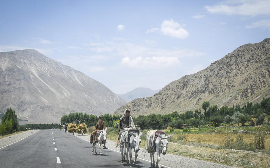 Farmers ride donkeys as they bring farming goods along a paved road into Baharak in remote Badakhshan province July 14, 2019. A third of the country's population may go hungry this winter, the U.S. Special Inspector General for Afghanistan Reconstruction reported.