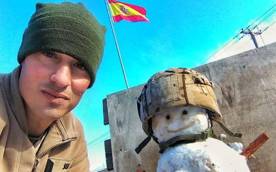 Cpl. David Miranda of the Spanish army is pictured here with a snowman he built at Camp Taji, Iraq, on Tuesday, Feb. 11, 2020, after snow fell on Baghdad.