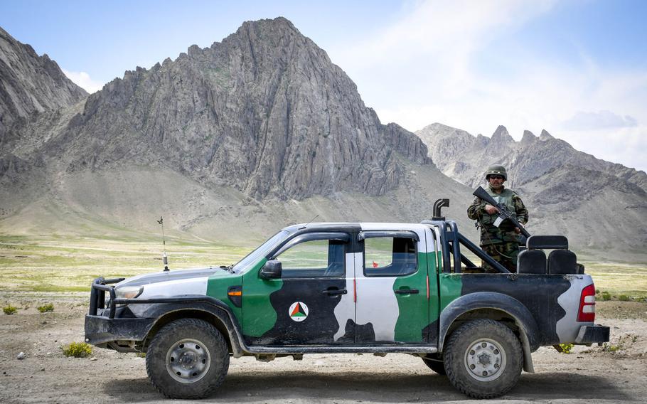 An Afghan soldier guards a highway checkpoint in Logar province on May 2, 2019. The Taliban have resumed offensives against Afghan government forces, days after a partial cease-fire ended and the signing of a peace accord with the U.S.