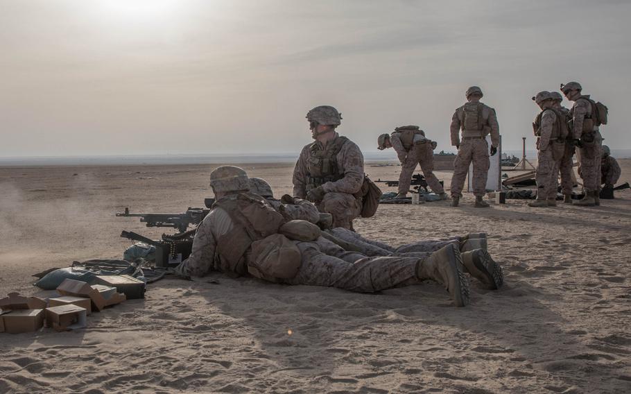 U.S. Marines with 2nd Battalion, 7th Marine Regiment, assigned to the Special Purpose Marine Air-Ground Task Force-Crisis Response-Central Command, fire M240B medium machine guns at a live-fire range in Kuwait, Feb. 19, 2020. Troops headed to the CENTCOM area will be quarantined prior to deployment because of coronavirus concerns.