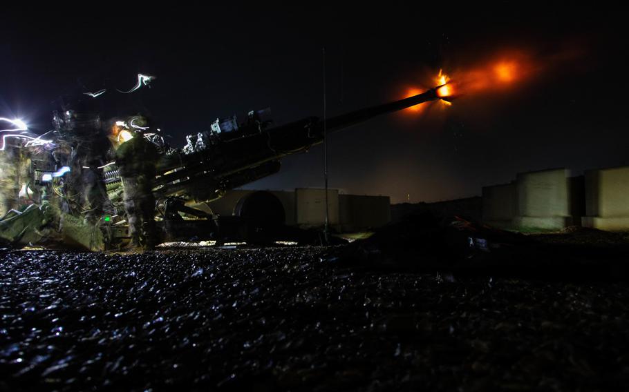 U.S. soldiers assigned to Task Force Automatic shoot 155 mm illumination rounds from a towed M777 howitzer at Qayara Airfield West, Iraq, March 13, 2020.