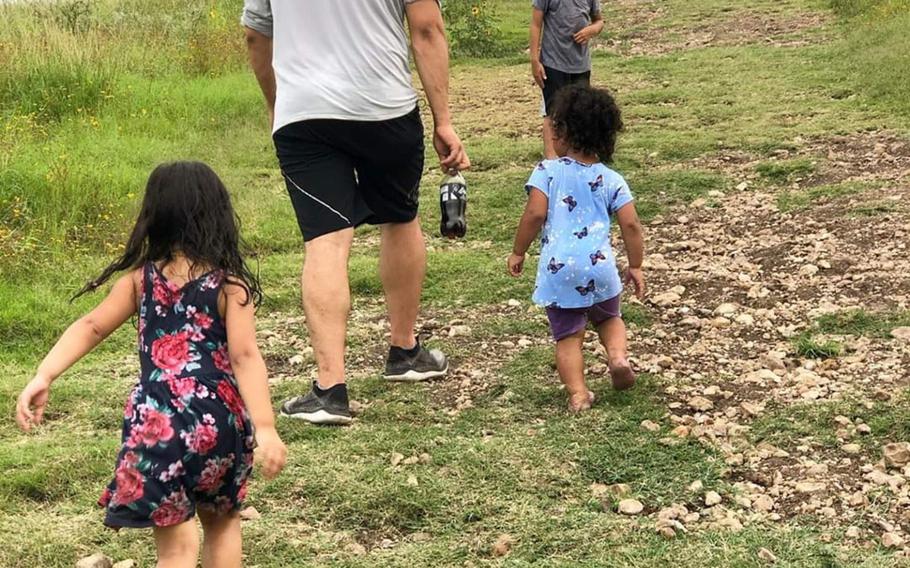Javier Jaguar Gutierrez and his four children hike in Pearsall Par in San Antonio, Texas, in July 2019, shortly before he was deployed it Afghanistan. Gutierrez died in combat weeks before the U.S.-Taliban peace agreement was signed. 