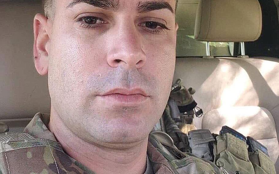 Sgt. 1st Class Elis A. Barreto Ortiz, 34, from Morovis, Puerto Rico, poses for a selfie from the cab of his pickup truck while on a convoy through Kabul, Afghanistan. Barreto, who was promoted posthumously, died Sept. 5 when a Taliban suicide bomb hit his convoy.