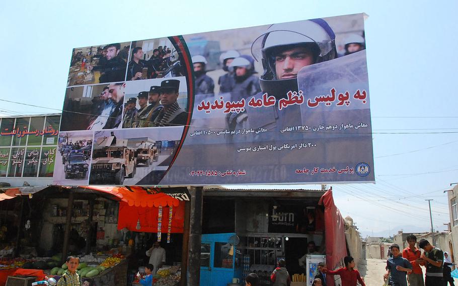 An Afghan national civil order police recruiting billboard in Kabul, Afghanistan in 2010. The Leonie Group, which produced television, radio and billboard ads in Afghanistan, billed the government for ads that were never disseminated, the company's former president alleges in a whistleblower lawsuit.