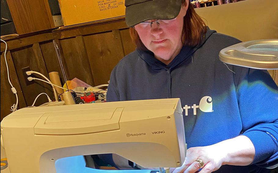 A volunteer for Soldiers' Angels, a charity based out of San Antonio, Texas, sews a face mask to send in a care package for deployed service members, April 8, 2020.