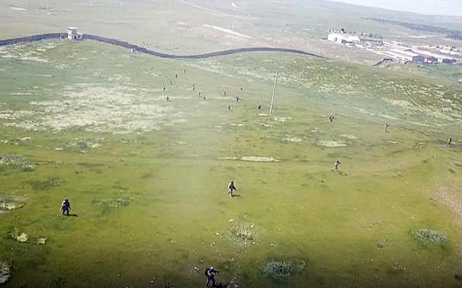 Iraqi forces conduct dismounted patrol training in April, as recorded by an anti-ISIS coalition drone. Special Operations Joint Task Force's Operation Inherent Resolve uses drones to provide remote feedback in support of partner force training, while mitigating the risk of coronavirus transmission.