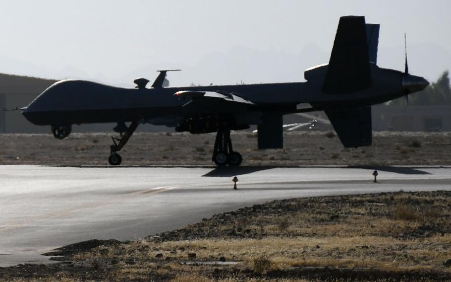 A U.S. MQ-9 Reaper drone taxis on the runway at Kandahar Airfield in November 2017. The U.S. military said this week that it will no longer release data on the number of airstrikes it conducts in Afghanistan, including those carried out using drones.