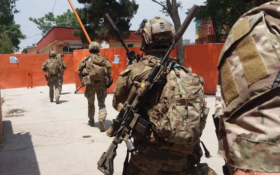 Afghan special operations police prepare to clear a hospital that came under attack by militants in western Kabul, Afghanistan, on Tuesday, May 12, 2020. The hospital attack targeted a maternity ward run by international humanitarian organization Doctors Without Borders, sources said.