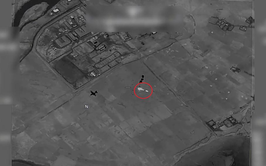 A screen shot depicts a rocket-propelled grenade, circled in red, heading toward a C-130J Super Hercules aircraft as it drops cargo in Afghanistan in September 2019. The crew, based out of Dyess Air Force Base, Texas, and deployed with the 774th Expeditionary Airlift Squadron, was aiding Afghan forces when it was fired upon. The crew members were later awarded Combat Action Medals.